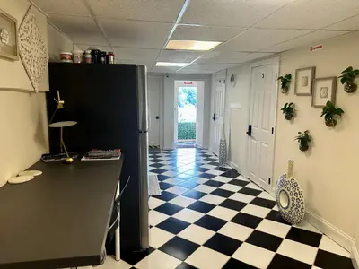 a hallway with a checkered floor in an office at 6-A Diamond in Yonkers, NY in Yonkers