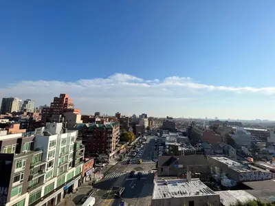 an aerial view of a city street with buildings at Starlight Hotel Near LGA Airport in Queens
