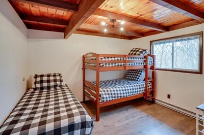 a bedroom with two bunk beds and a window at Hunter Mountain Home with Game Room 1 Mi to Skiing! in Hunter