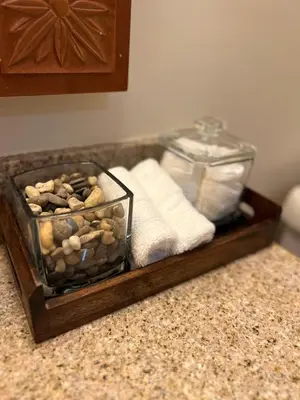 a tray filled with rocks and towels on a counter at Cozy Mountain View Condo in Vernon Township