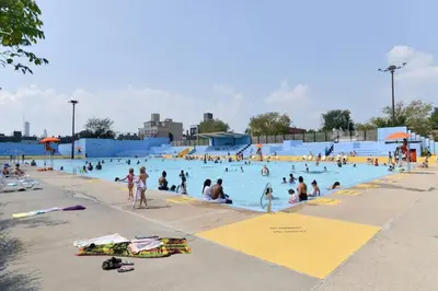 a group of people in a pool at a water park at Tuk Ahoy - Indigo Suite (3A) with Shared Spaces in Brooklyn