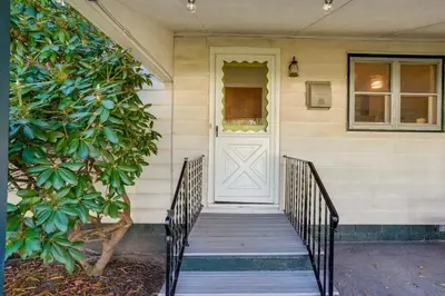 a front door of a house with a staircase at Windham Home Near Mountain Biking and Hiking Trails! in Windham