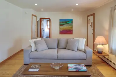 a living room with a couch and a table at Windham Home Near Mountain Biking and Hiking Trails! in Windham