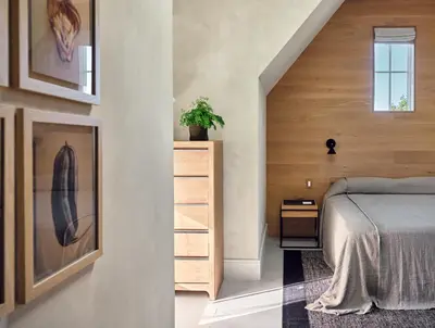 a bedroom with a bed and a wooden wall at 9 Academy in Salisbury
