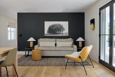 a living room with a couch and a table at 9 Academy in Salisbury