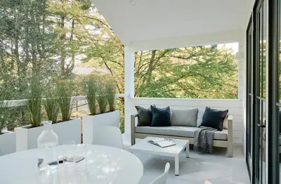 a patio with a couch and a table at 9 Academy in Salisbury