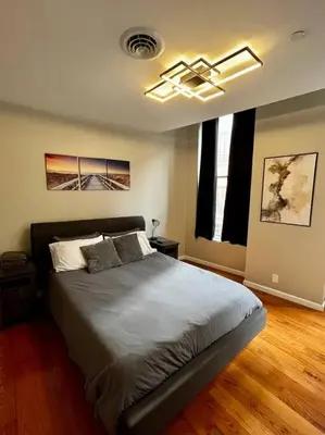 a bedroom with a large bed in a room at Downtown Albany 2 Bedroom + Workstation @ The Mark in Albany