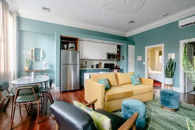 a living room with a couch and a table at Airy Greenwich Retreat with Private Deck in New York