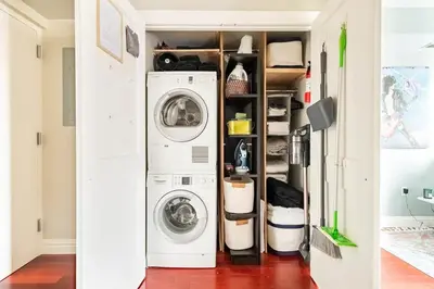 a laundry room with a washer and dryer at Lofty & Bright Greenwich Getaway w Private Rooftop in New York
