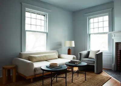 a living room with a white couch and two tables at CoHouse New Haven steps to Yale University in New Haven