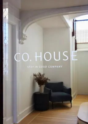 a living room with a chair and a couch at CoHouse New Haven steps to Yale University in New Haven
