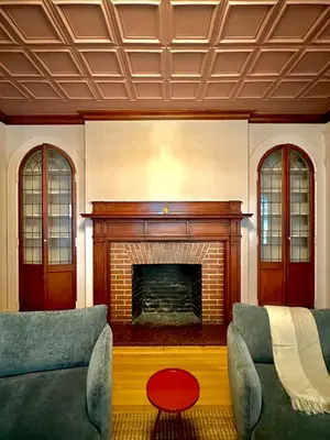 a living room with two couches and a fireplace at CoHouse New Haven steps to Yale University in New Haven