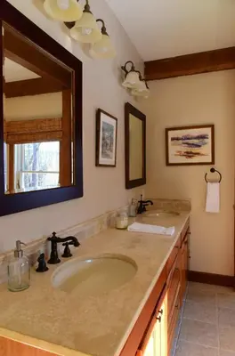 a bathroom with a sink and a mirror at Berkshire Vacation Rentals: Peaceful Post and Beam Loft Sleeps 9 in New Marlborough