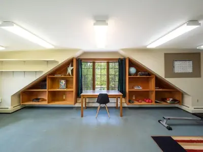 a large room with a table and a window at Berkshire Vacation Rentals: Renovated Five Bedrooms In Historic Williamstown in Williamstown