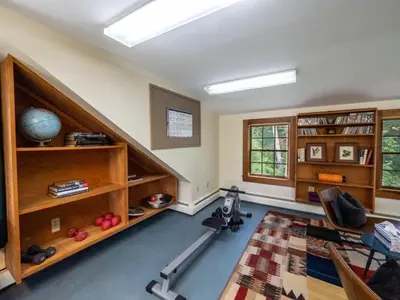 a room with a gym with a treadmill in it at Berkshire Vacation Rentals: Renovated Five Bedrooms In Historic Williamstown in Williamstown