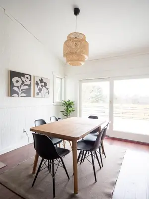 a dining room with a wooden table and chairs at Berkshire Vacation Rentals: Chic Pittsfield Home With A View in Pittsfield