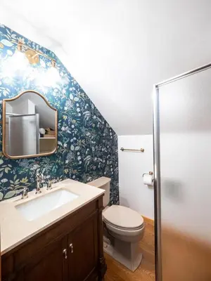 a bathroom with a sink and a toilet at Berkshire Vacation Rentals: Private Cabin On Over 12 Acres Of Woods in Becket