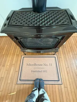 a box with a tag on the floor with a tie at Schoolhouse No. 11 * Hudson Valley Upstate Getaway in Stone Ridge