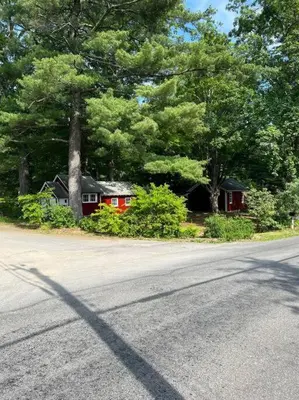 a house on the side of a road with trees at Schoolhouse No. 11 * Hudson Valley Upstate Getaway in Stone Ridge