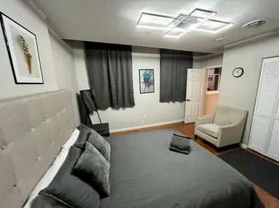a living room with a bed and a couch and a chair at Downtown Albany 1 Bed + Workstation @ Maiden Lane in Albany