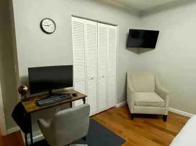 a room with a desk with a computer and a chair at Downtown Albany 1 Bed + Workstation @ Maiden Lane in Albany