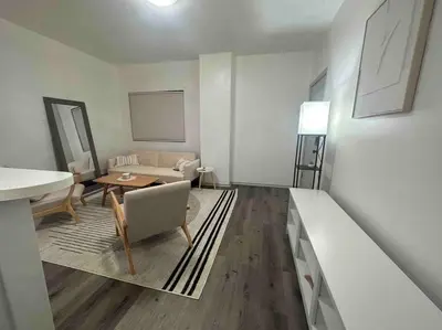 a living room with a couch and a table at 2 KING Beds WD Parking Stylish GREAT VALUE in Schenectady