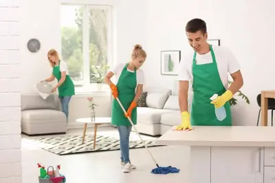 a man and woman cleaning a kitchen with a mop at 2 KING Beds WD Parking Stylish GREAT VALUE in Schenectady