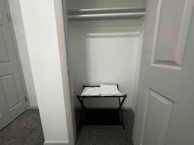 a small room with a door with a table in it at 2 KING Beds WD Parking Stylish GREAT VALUE in Schenectady