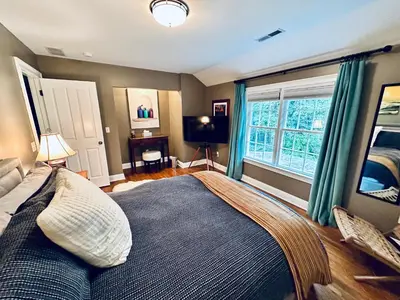 a bedroom with a large bed and a window at Upmarket Country Retreat, Washington, Connecticut in Washington