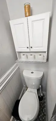 a bathroom with a white toilet with white cabinets at Private Apt In Middletown-wesleyan in Middletown