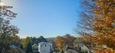 a town in the fall with trees and houses at Private Apt In Middletown-wesleyan in Middletown