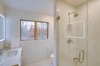 a bathroom with a shower and a sink and a toilet at Brand New Luxury Ski Cabin - 2 Mi to Windham Mtn! in Windham