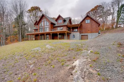 a large house on top of a hill at Brand New Luxury Ski Cabin - 2 Mi to Windham Mtn! in Windham