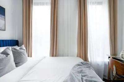 a bedroom with a white bed and a window at 91-2A Stylish 3BR 2Bth with W D in New York