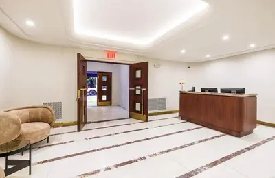 an office with a reception desk and a lobby at 52-3DE Newly renovated 2BR BTH Midtown East in New York