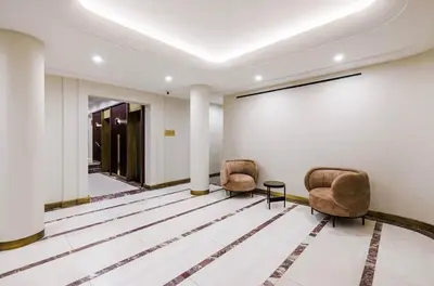 two chairs in a room with a white wall at 52-3DE Newly renovated 2BR BTH Midtown East in New York