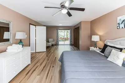 a bedroom with a bed and a ceiling fan at Horatio Hideaway Pocono Escape in Tobyhanna