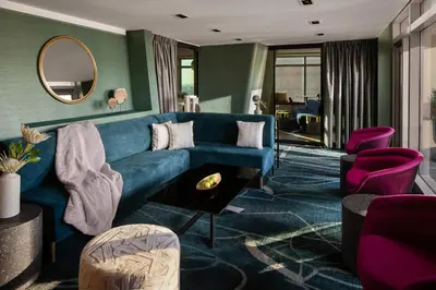 a living room with a blue couch and purple chairs at Financial District 1br w WD gym elevator NYC-1360 in New York