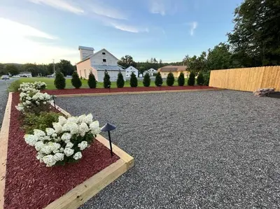 a garden with white flowers in a driveway at 2 Bed Berkshire Getaway @ Stephentown Hotel in Stephentown