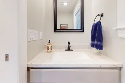 a bathroom with a sink and a mirror at Modern Mountain Homestead in Dover