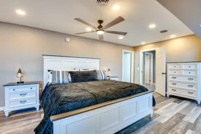 a bedroom with a bed and a ceiling fan at Family Home on Lake Newton with Deck and Fire Pit in Carbondale