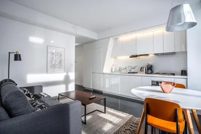 a living room with a couch and a table at Financial District 1br w WD gym elevator NYC-1378 in New York
