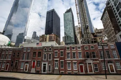 a red brick building in a city with tall buildings at FiDi jr 1br w game room resident-only bar NYC-1336 in New York