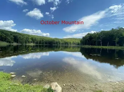 a view of a lake with the words october mountain at 5 Bed / 3 bath Apt Near Jiminy Peak Berkshires in Stephentown