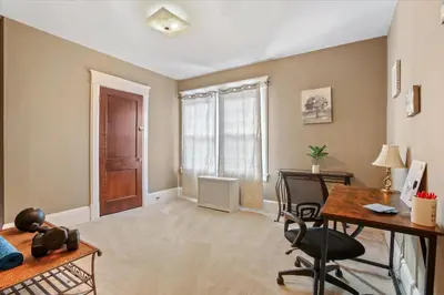an empty living room with a desk and a window at Greenridge Getaway:Near Universities & Attractions in Scranton