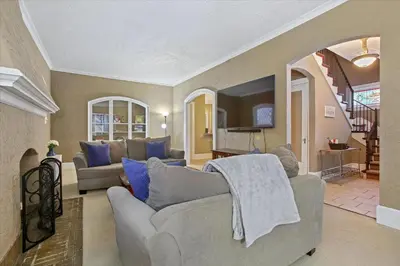 a living room with a couch and a tv at Greenridge Getaway:Near Universities & Attractions in Scranton