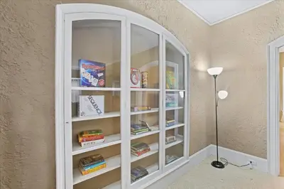 a white book shelf in a corner of a room at Greenridge Getaway:Near Universities & Attractions in Scranton
