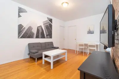 a living room with a couch and a table at The Upper East Side Monthly Rentals Apartments in New York