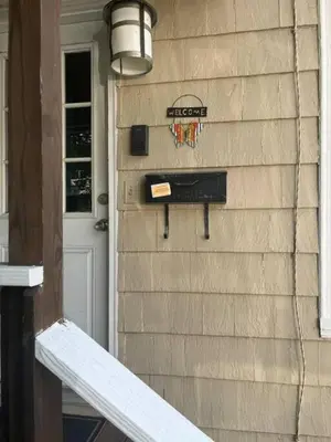 a mailbox on the side of a house at Intimate 1 Bedroom Apt by UHS in Binghamton