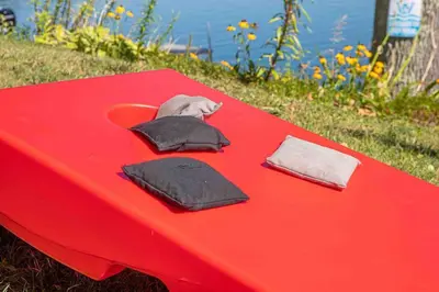 a red table with two pillows on top of it at Hamilton Home #4 in Hamilton